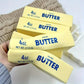 🥳2026 HOT SALE🧈✨50K+ SOLD! Super Soft Squishy Butter Scent Stick Stress Toy
